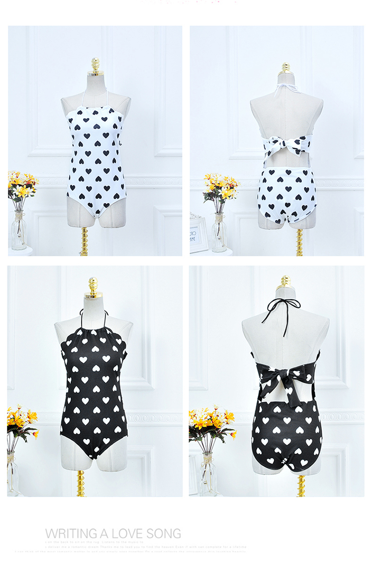 ***พร้อมส่ง***บิกินี่ชุดว่ายน้ำวันพีซ one-piece สีขาวลายดำรูปหัวใจ ด้านข้างแขนแต่งขอบหยักผูกโบว์เล็กๆ น่ารักที่คอ เล่นดีเทล sexy เล็กๆ โชว์แผ่นหลัง สดใสน่ารักรับลมทะเล สวยเหมือนแบบค่ะ