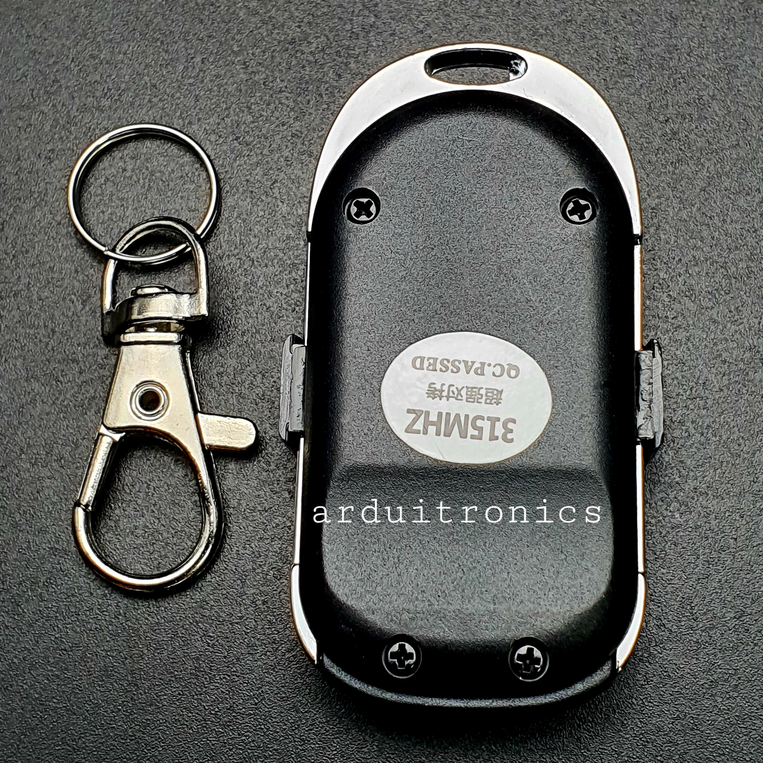 Remote RF 315 MHz ปุ่ม ขึ้น/ลง (กรอบโลหะ สีดำ-เงิน)