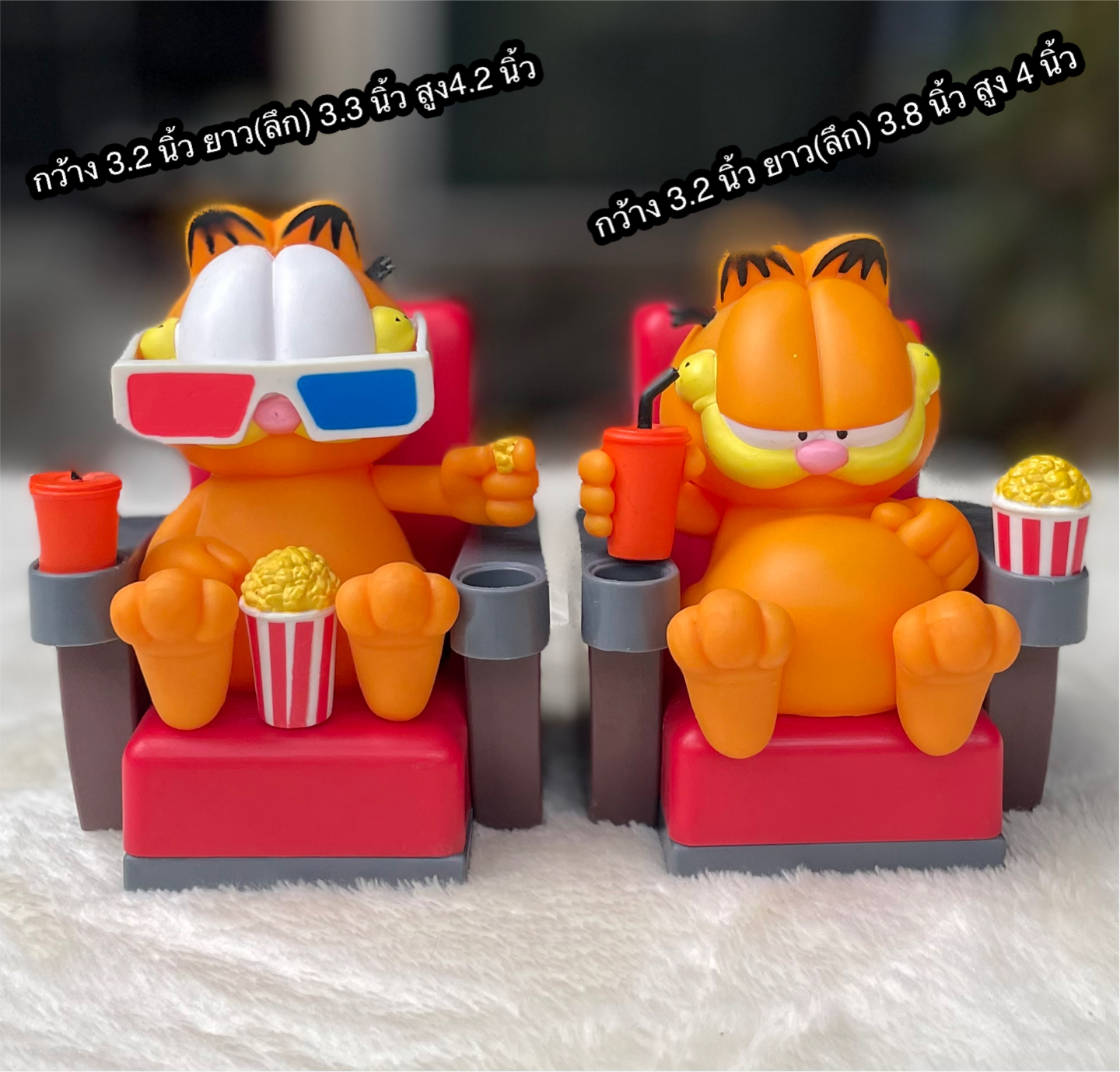 ราคาต่อชิ้น ￼ท็อปเปอร์แก้วโรงหนังแมวส้มการ์ฟิลด์ Topper Garfiled : Garfield sitting in a movie theater chair with a drink and popcorn
