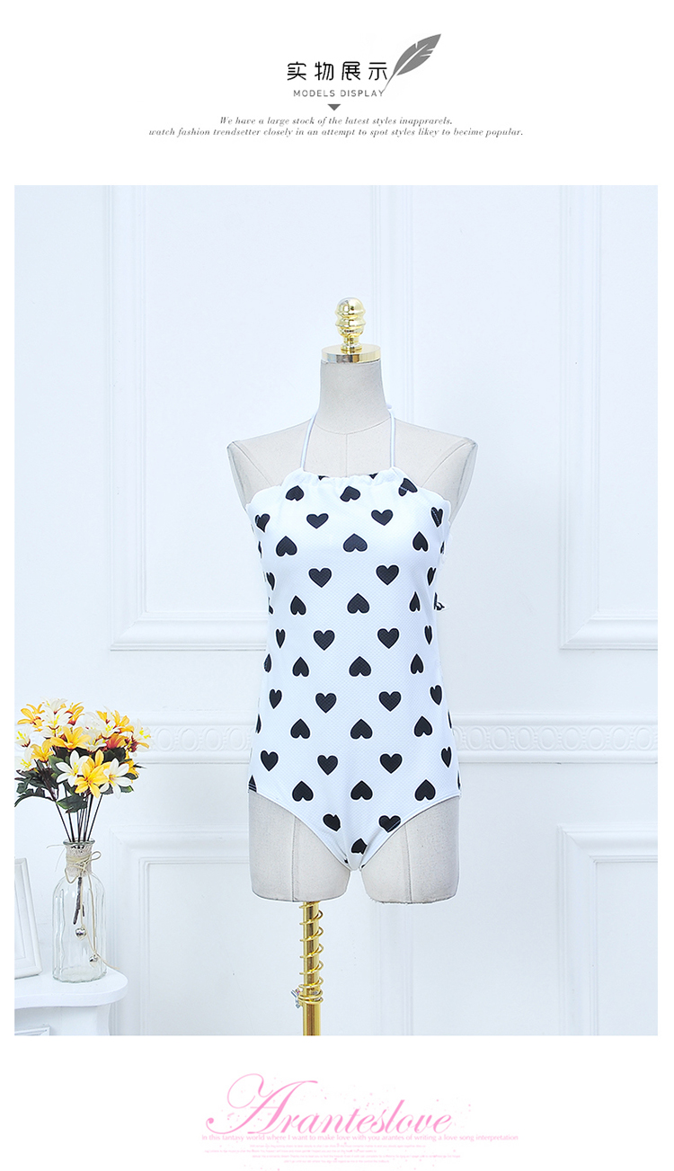 ***พร้อมส่ง***บิกินี่ชุดว่ายน้ำวันพีซ one-piece สีขาวลายดำรูปหัวใจ ด้านข้างแขนแต่งขอบหยักผูกโบว์เล็กๆ น่ารักที่คอ เล่นดีเทล sexy เล็กๆ โชว์แผ่นหลัง สดใสน่ารักรับลมทะเล สวยเหมือนแบบค่ะ